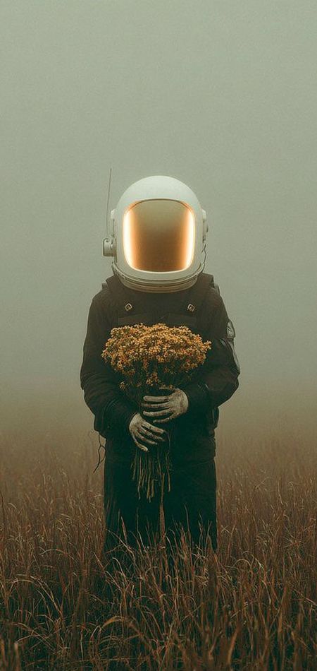 Cosmic Bloom: solitary astronaut holding a bouquet of yellow wildflowers in a meadow